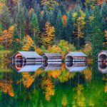 Misty morning on Altaussee village.Misty autumn scene in the morning. Mirror reflection. Location: resort village Altaussee, Liezen District of Styria, Austria, Alps. Europe.